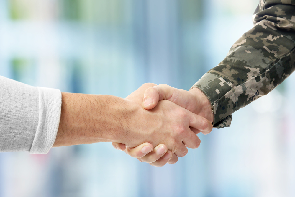 Veteran shaking hands with employer