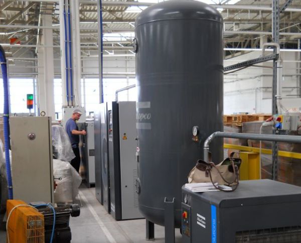 Atlas Copco GA compressor with FX 14 dryer and air receiver in an industrial plant